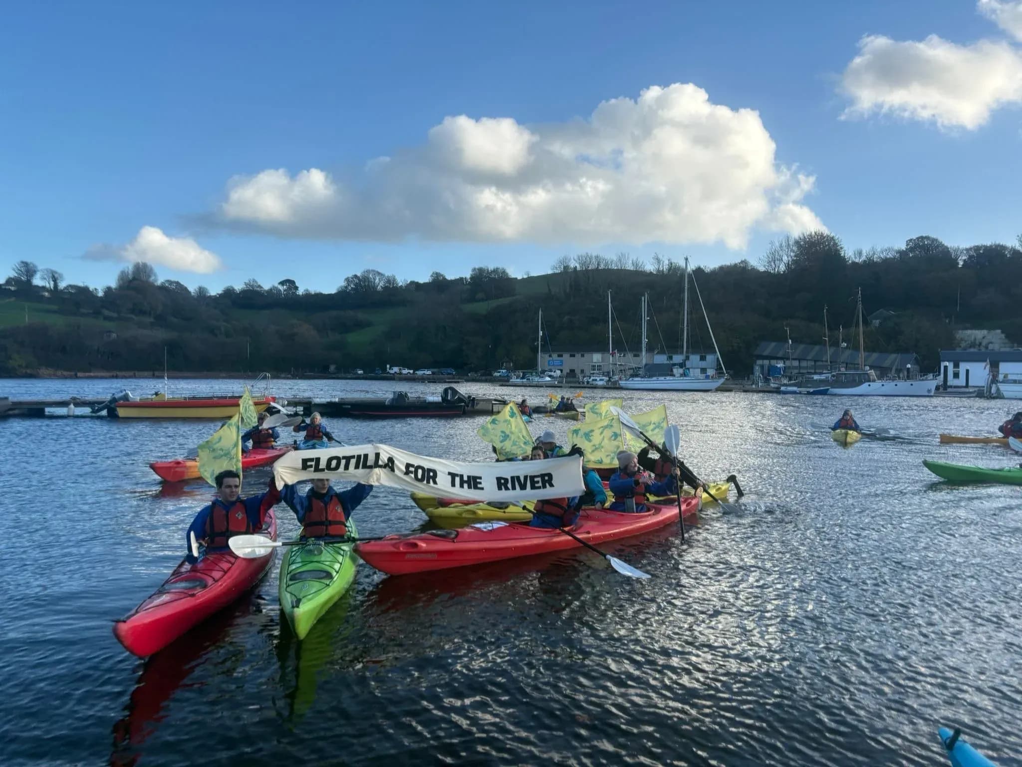 A flotilla of boats on the River Dart